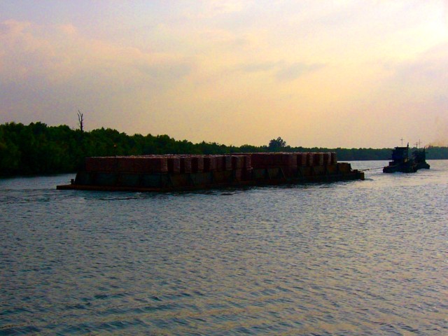 barge with bricks under double tow